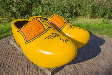 Pair of large yellow wooden shoes in Zaanse Schans