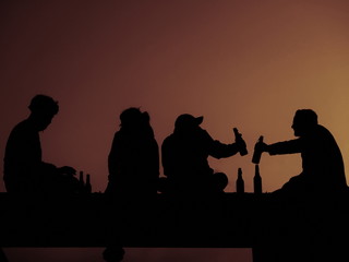 Silhouette of four friend