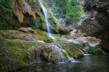 Fototapeta na wymiar The Salt de la Caula waterfall The Waterfall of la Caula at Pont Molins near Girona, Spain