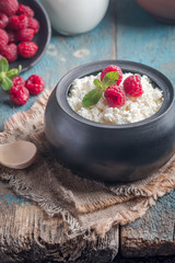 Fresh homemade cottage cheese with raspberries