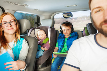 Fototapeta na wymiar Happy family having fun travelling by car