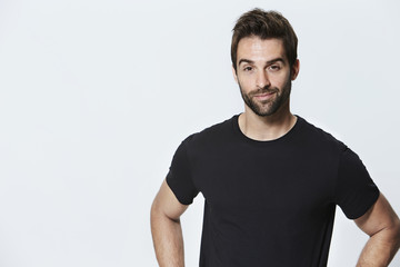 Dude in black t-shirt against white background