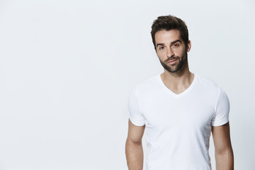 Fototapeta premium Man in white t-shirt in studio, portrait