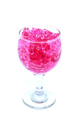 pink hydrogel  in wine glass isolated on white background
