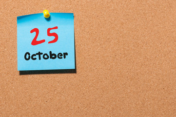 October 25th. Day 25 of month, color sticker calendar on notice board. Autumn time. Empty space for text