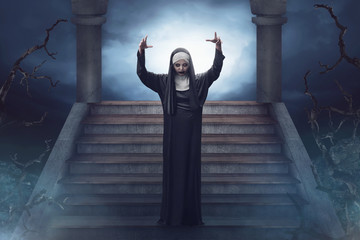 Devil asian nun walks down the ruins stairs - obrazy, fototapety, plakaty
