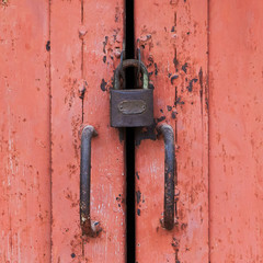 Red wooden door with master key ancient
