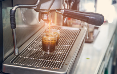 espresso coffee machine with filter make coffee flowing into a c