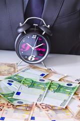 clock with cash, time is money