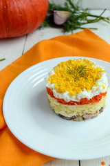 Easy Diet salad layers in the shape of a circle (tuna in oil, boiled potatoes, carrots, eggs). Alternative Slavonic traditional dish 