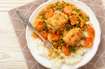 Roasted turkey roulades served with stewed vegetables and rice.