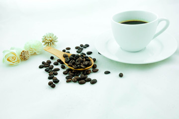 Fototapeta na wymiar A cup of coffee and coffee beans. White background.