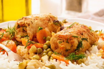 Roasted turkey roulades served with stewed vegetables and rice.