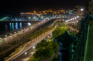 View on Tarragona railways, beach and port at night, Spain