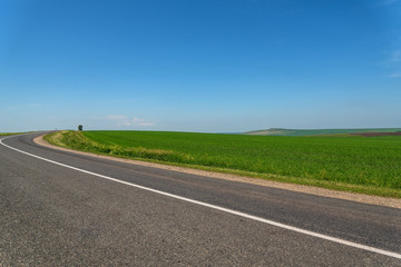 Fototapeta premium road fields mountains asphalt