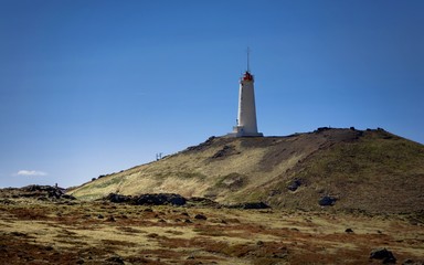 Fototapeta na wymiar Lighthouse on the hill