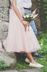 Fototapeta premium Beautiful wedding bouquet in hands of the bride