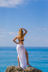 Fototapeta na wymiar woman relaxing on the beach in Greece