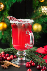 Festive Cranberry drink on Christmas background, holiday concept