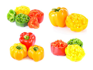colored peppers over white background