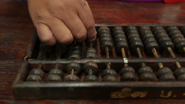 chinese abacus is a calculating tool used primarily in parts of Asia for performing arithmetic processes. The abacus was in use centuries before the adoption of the written modern numeral system.
