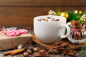 Сup with Christmas hot drink, gifts and gingerbread cookies