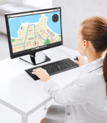businesswoman with gps navigator map on computer
