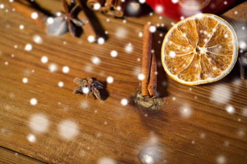 cinnamon, anise and dried orange on wooden board