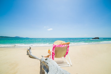 Woman on a deck chair at the beach