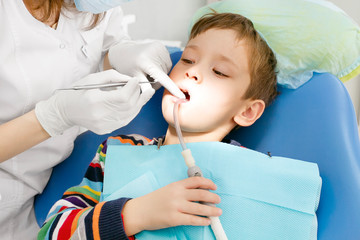 Boy and dentist during a dental procedure