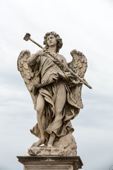Obraz premium Marble statue of Angel with the Sponge by .Antonio Giorgetti from the Sant'Angelo Bridge in Rome, Italy,