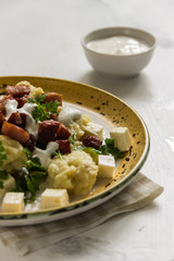 Potato dumplings, cheese and sausage