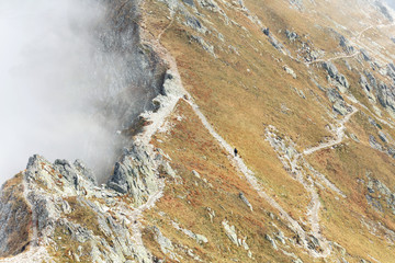 Autumn landscape of foggy mountains