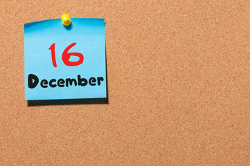 December 16th. Day 16 of month, Calendar on cork notice board. Winter time. Empty space for text