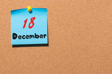 December 18th. Day 18 of month Calendar on cork notice board. Winter time. Empty space for text