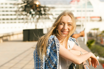 Fototapeta premium Picture of shining blonde lady in blue jacket smiling while she