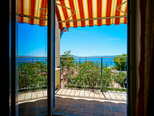 Beautiful view to sea from the inside of apartments. Balcony wit