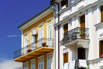 Fototapeta na wymiar House with balcony on sea resort, sunny day, touristic concept.