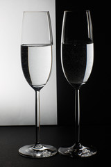 two glasses on the black and white