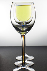 three glasses with wine on the table