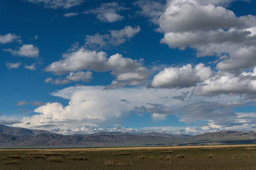 mountains steppe sky clouds
