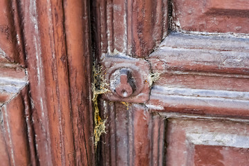 Old wooden door. Detail. Door lock