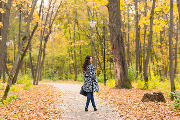 Street fashion concept - portrait of a pretty girl. Beautiful autumn woman.