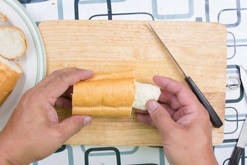 Hand with knife penetrate bread