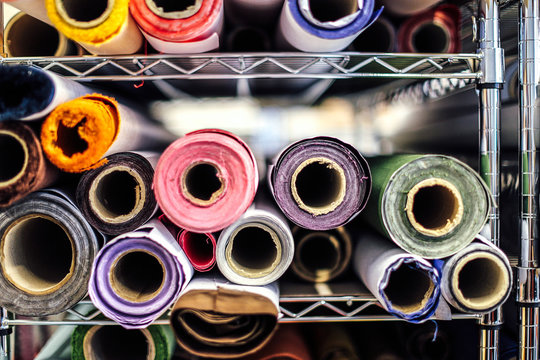 Close-up of rolls of cloth in book arts workshop