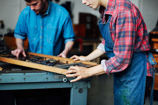 Man and woman working in printing shop