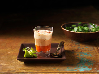 Christmas, celebration food, devilled crab layered appetisers with fresh lime slice and coriander