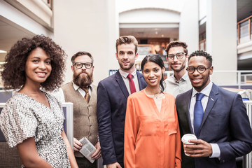 Portrait of male and female business team in office