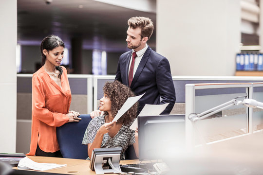 Businesswoman preparing paperwork at office desk