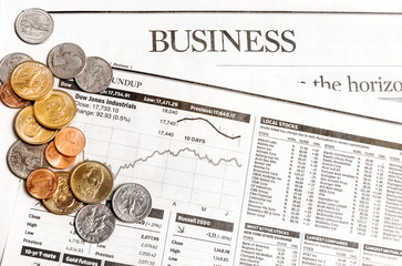 Coins on the business newspaper.